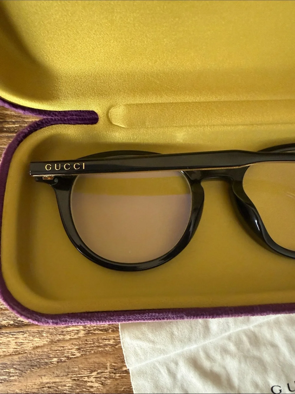Gucci Black Round Optical Glasses with purple case, dust bag, and cleaning cloth
